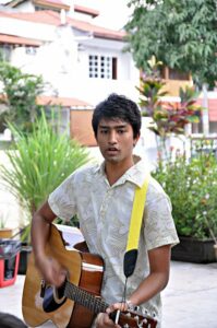 Handsome guy playing guitar