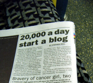 A picture of a newspaper with 20,000 Britains starting a blog each day